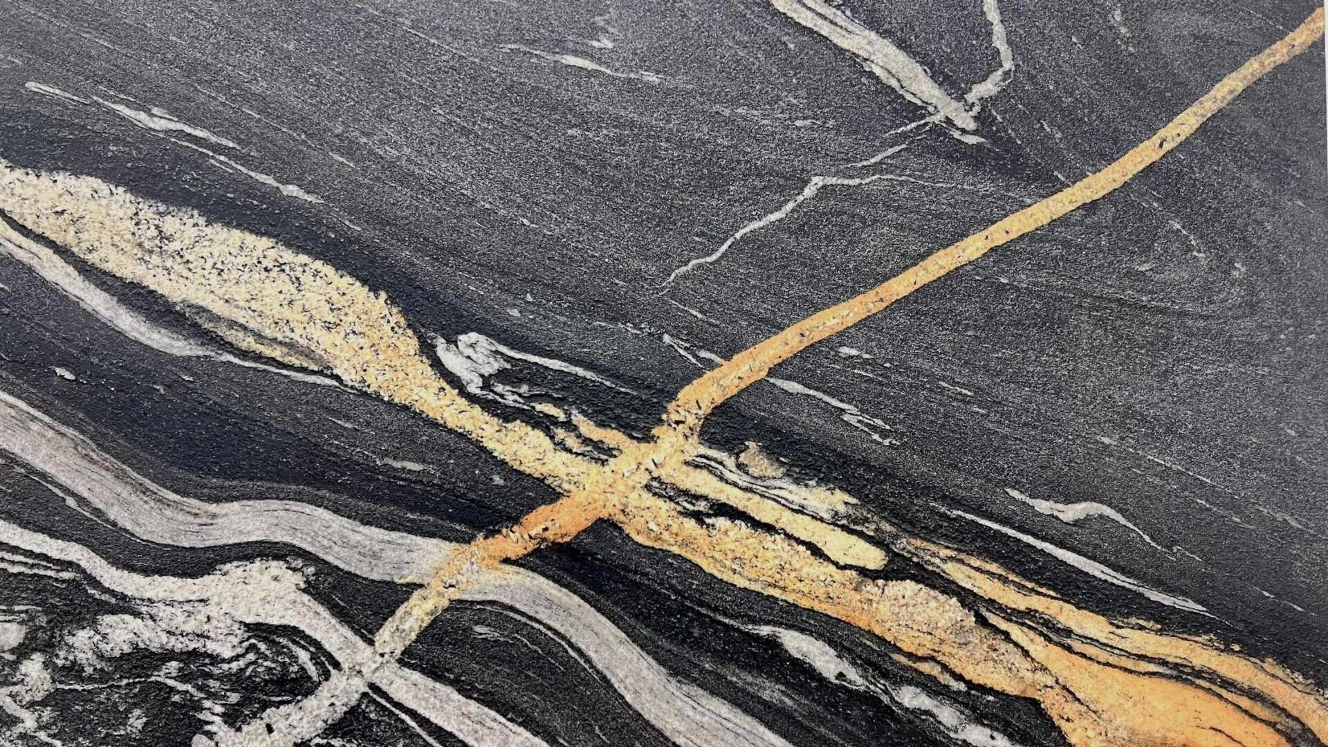 Copacabana black granite slab with gold veining