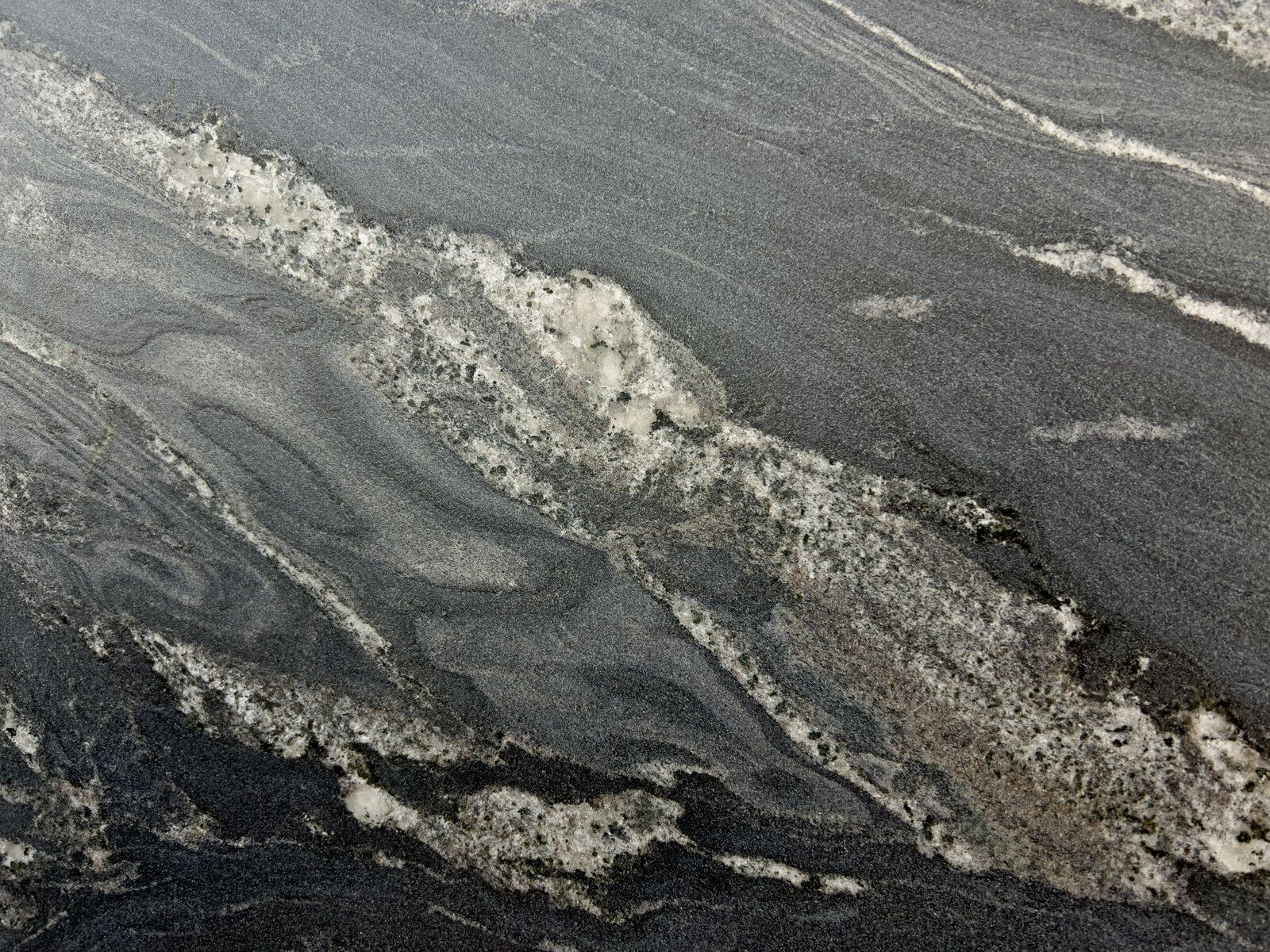 Storm Black granite slab with grey veining