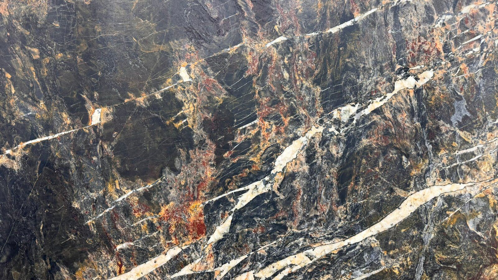 Firestone charcoal quartzite slab with rust veining